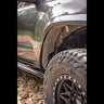 View back at the passenger side fender showing the aluminum fender liners included with the C4 High Clearance Fender Liner kit.
