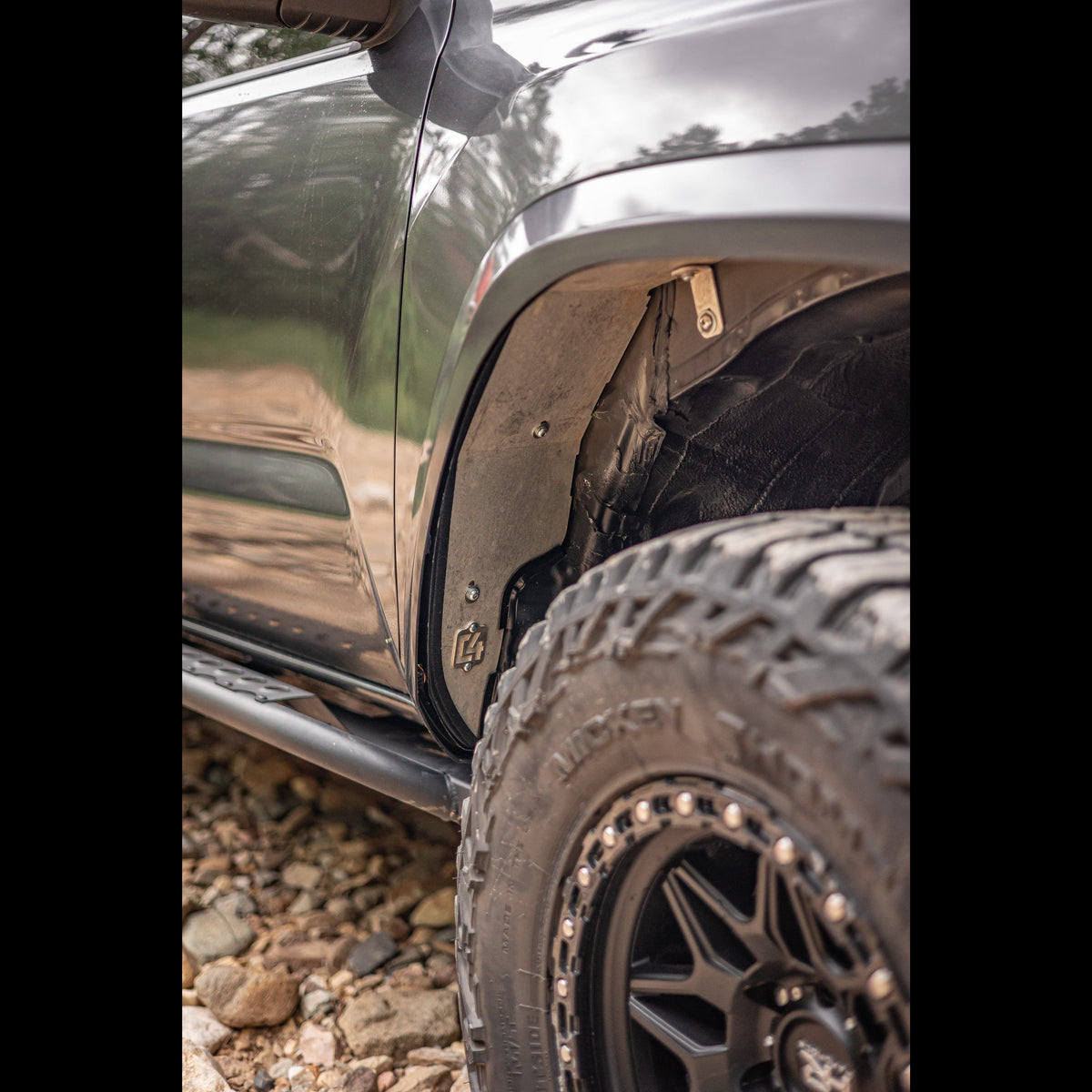 View into the back of the passenger side after installation of the C4 Oversize Tire Fitment Kit.