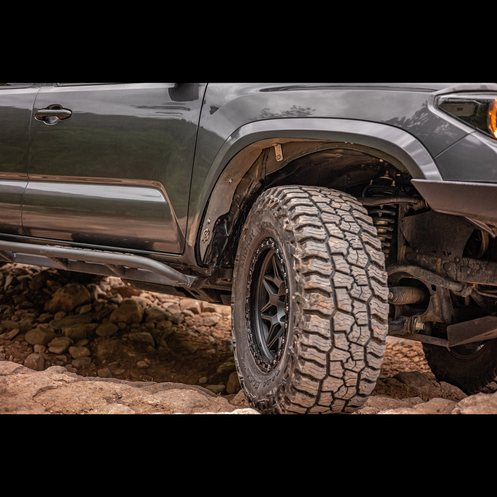 View of a complete Oversize Tire Fitment Kit installed on a 3rd Generation Tacoma.