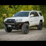 White V8 4Runner with moderate lift and an Overland winch bumper with low bull bar from C4 Fabrication.