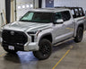Wide view of a silver 2022+ Tundra equipped with the C4 steel Sliders.