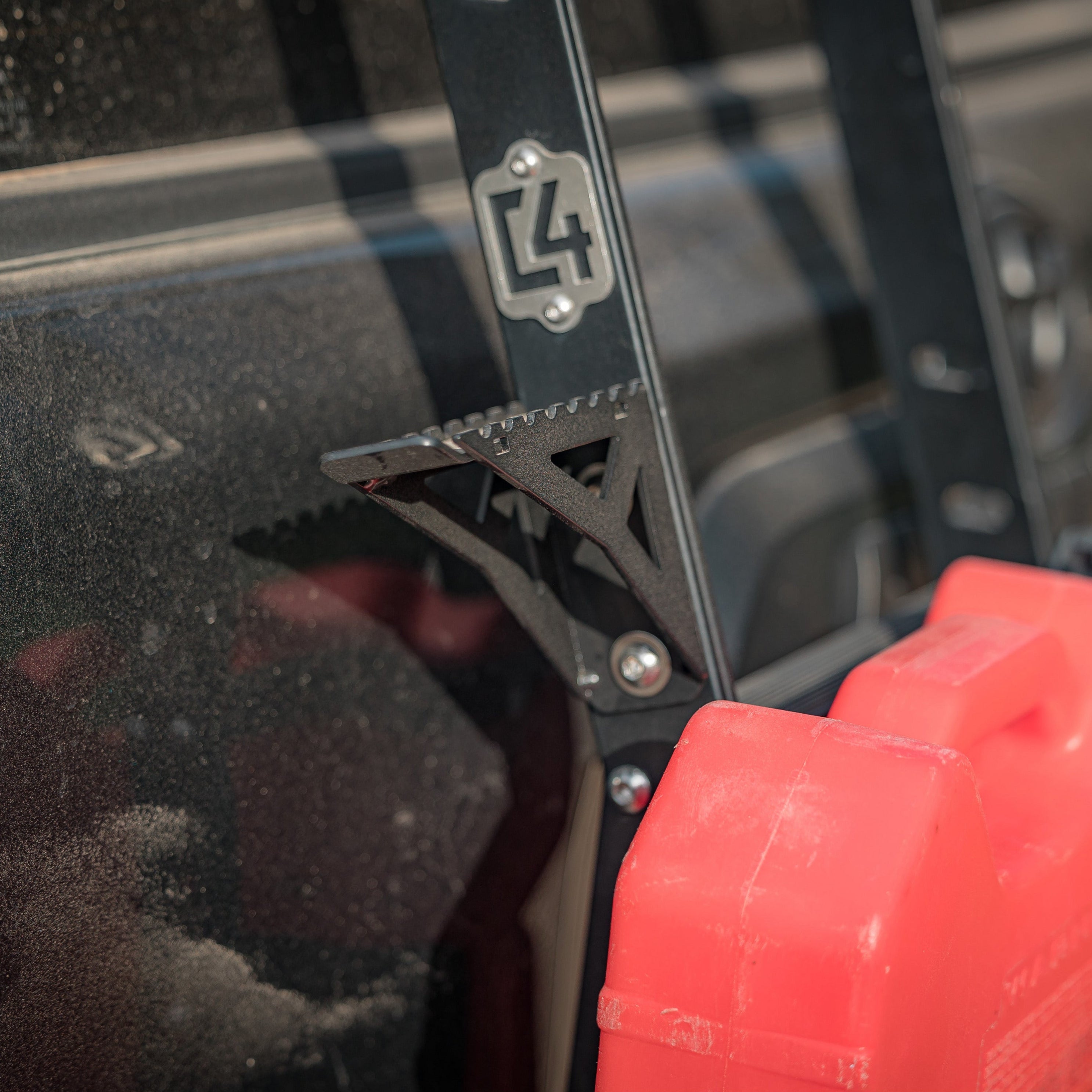 Side view of the accessory side steps for the C4 Summit hatch ladder that show how they bolt to the many available mounting holes built into the ladder uprights.