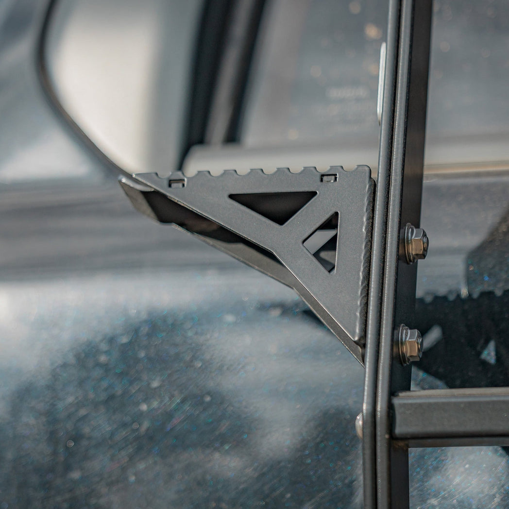 Close up side view of the accessory side step for the C4 Summit hatch ladder.