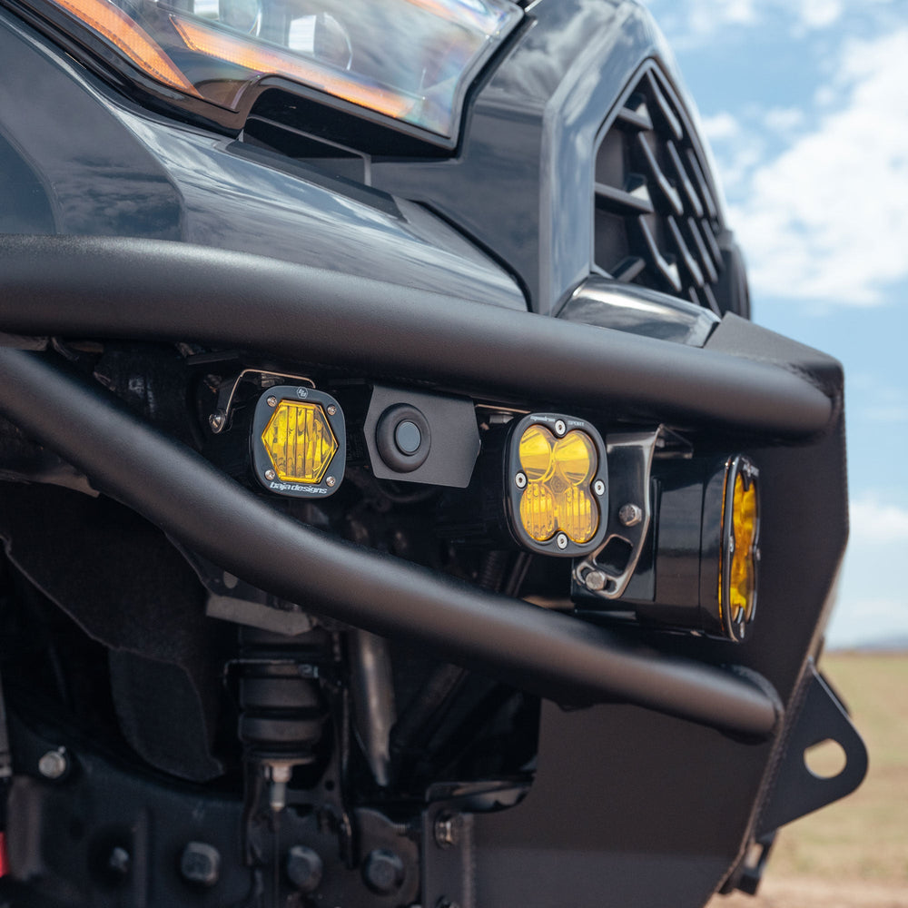 Detail image of sensor relocator and installed Baja Designs pod lights on the 6th Gen 4Runner Hybrid Front Bumper by C4