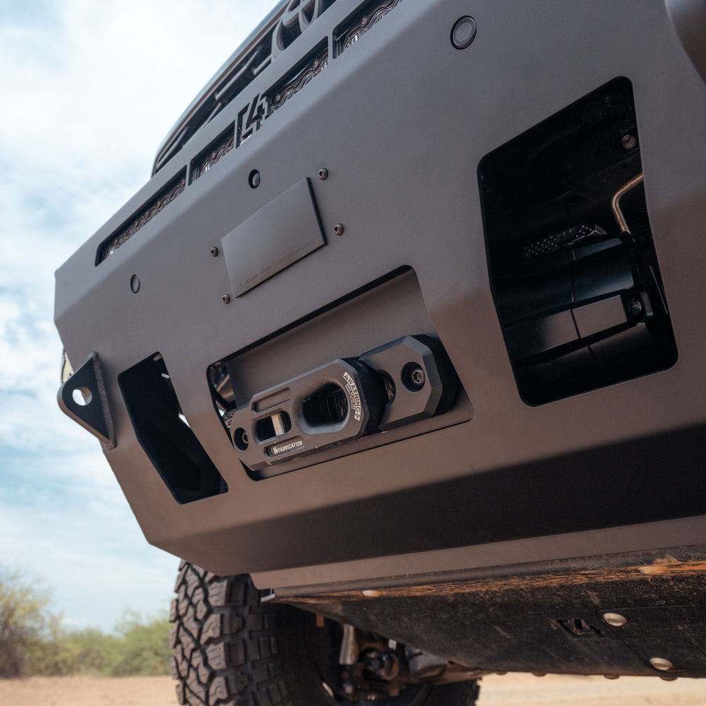 Close up image of installed 6th Gen 4Runner Hybrid Front Bumper with winch, winch fairlead, front factory sensors, and tow hooks