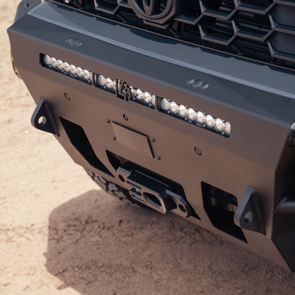 Close up image of 6th Gen 4Runner Hybrid Front Bumper installed with lightbar, winch, tow hooks, and sensors for full oem functionality