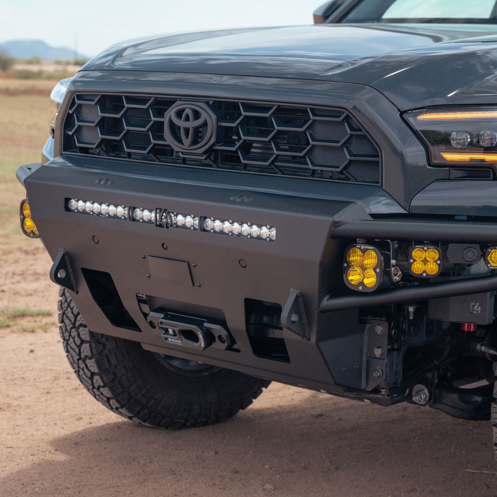 Angled close-up of the winch-ready C4 6th Gen 4Runner Hybrid Front Bumper with tow hooks and design for auxiliary lighting