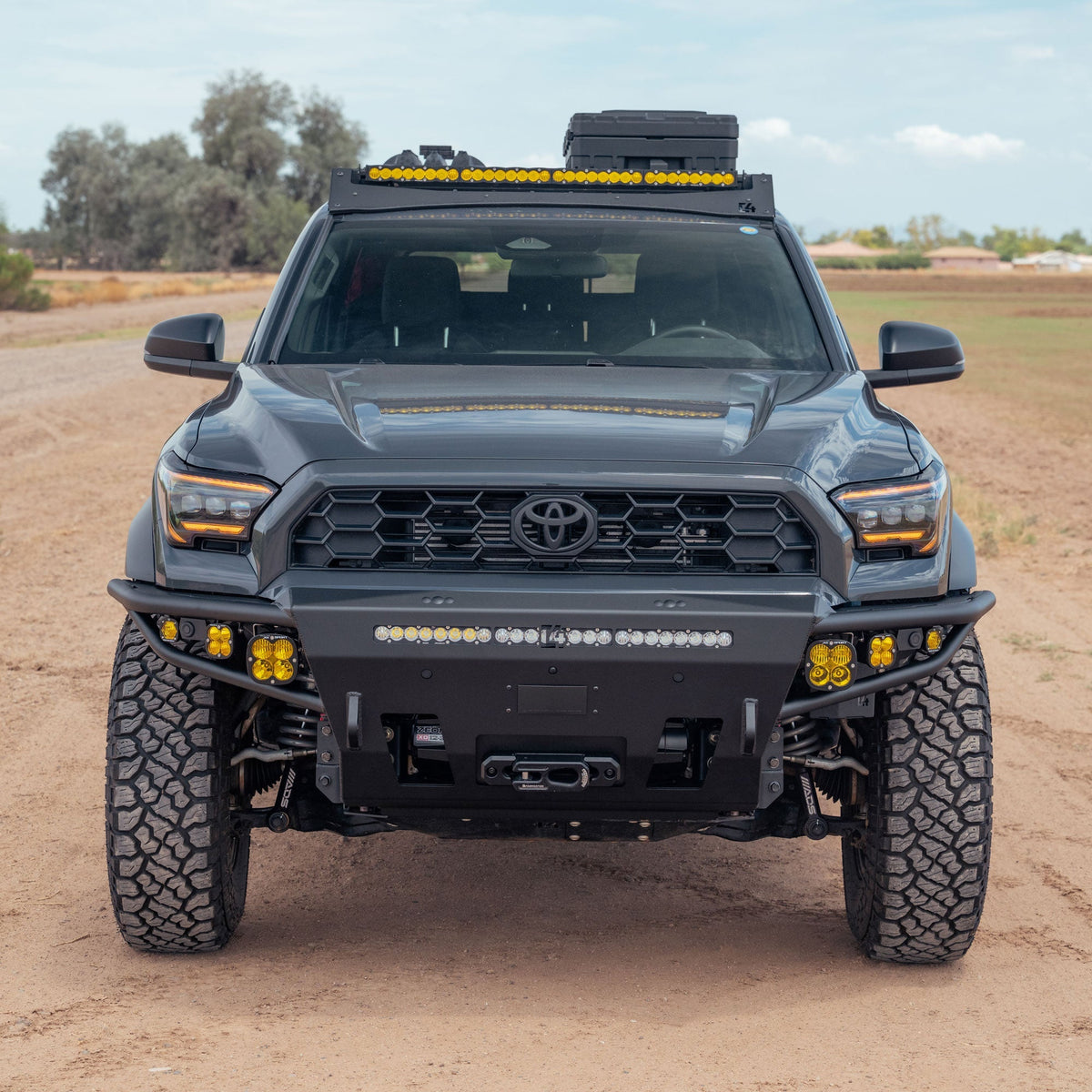High front angle view of 6th Gen 4Runner Hybrid Front Bumper installed on black Toyota 4runner driving in the dirt