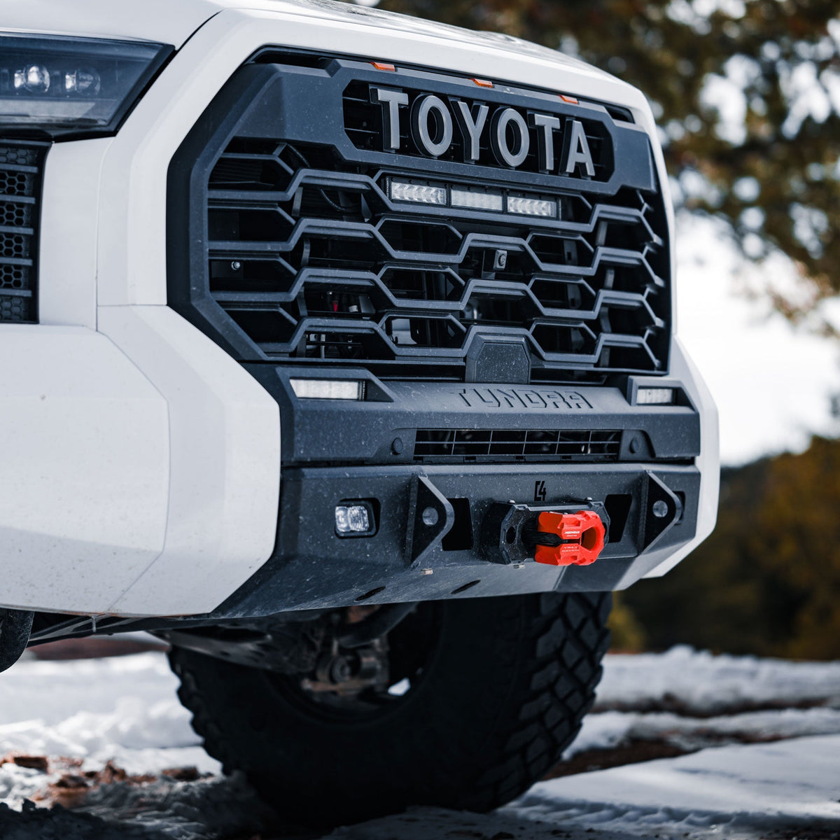 Cover photo of the C4 Lo-Pro winch bumper for the 3rd Generation Tundra with the background faded out and emphasis on the truck and bumper.
