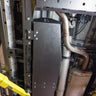 Alternate view of a 2024 Tacoma on a lift showing the steel protection provided by the C4 Fuel Tank Skid.
