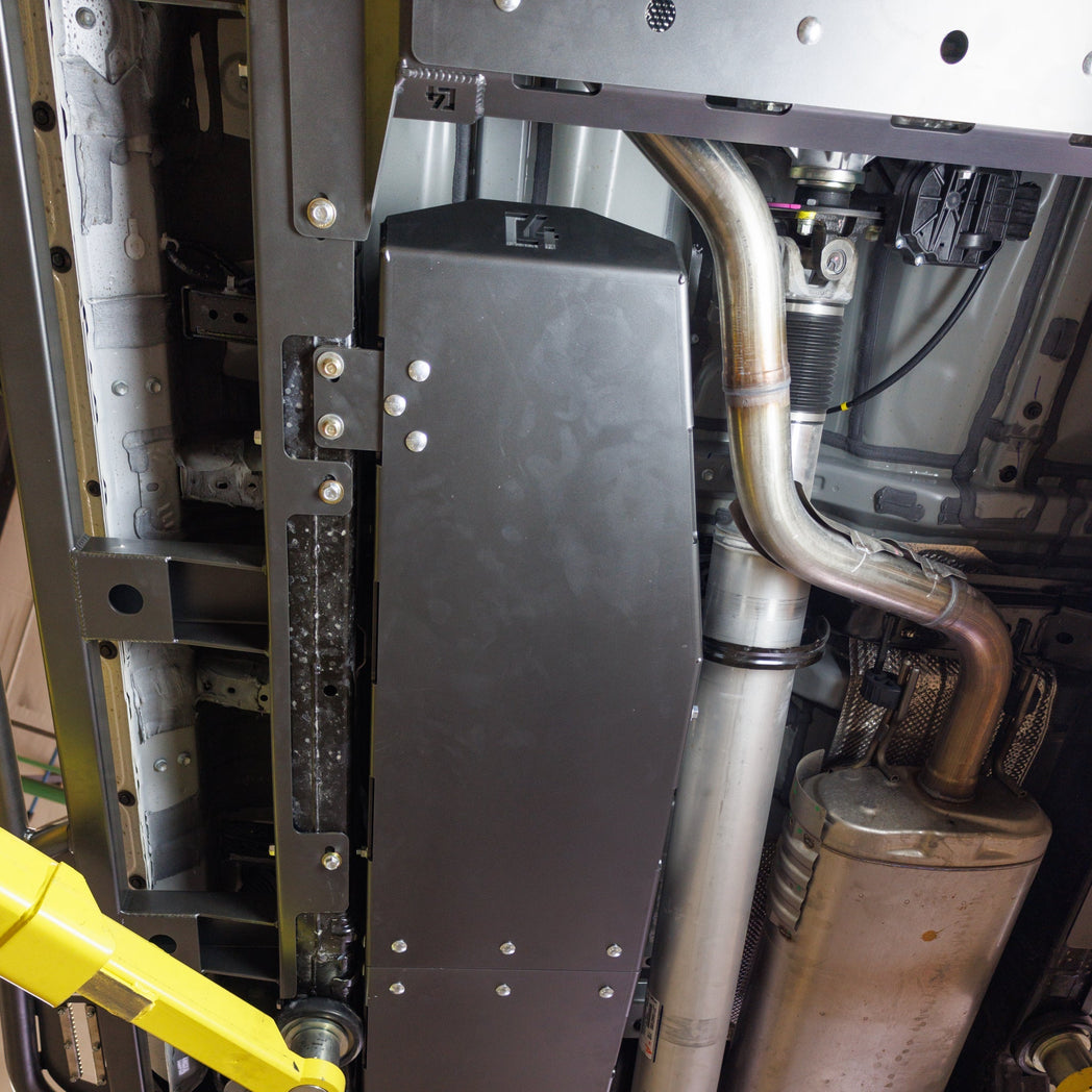 Alternate view of a 2024 Tacoma on a lift showing the steel protection provided by the C4 Fuel Tank Skid.