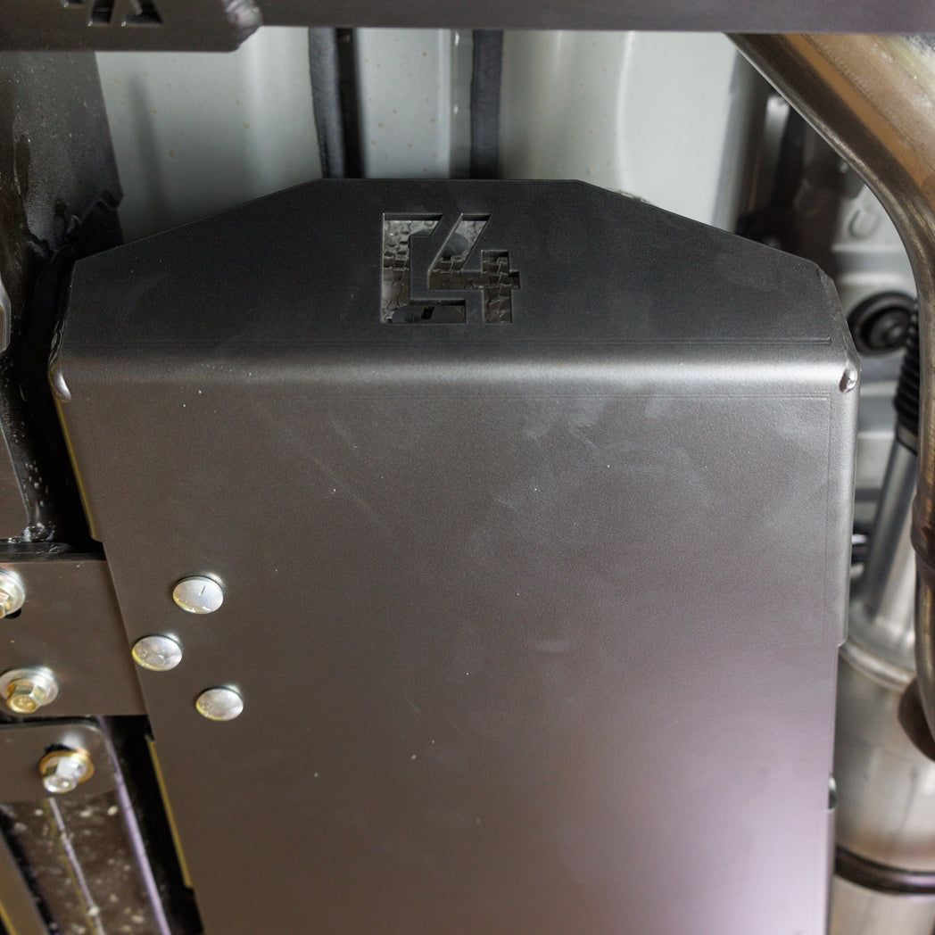 Close up of the leading edge of the C4 Fuel Tank Skid for Tacomas showing the laser-engraved C4 logo and the wrap-around construction of the skid.