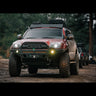 Salsa red pearl 4Runner equipped with a C4 Overland front bumper on an offroading trip in the mountains.