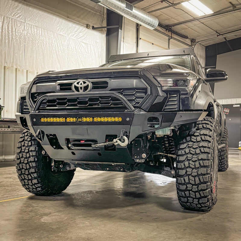 C4 Overland winch bumper with low bull bar installed on a black 2024 Tacoma. 