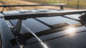 Car roof rack with Sherpa branding on a vehicle in an outdoor setting.