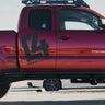 View from the side showing the rocker and front bed protection of the C4 Rock Runner sliders.