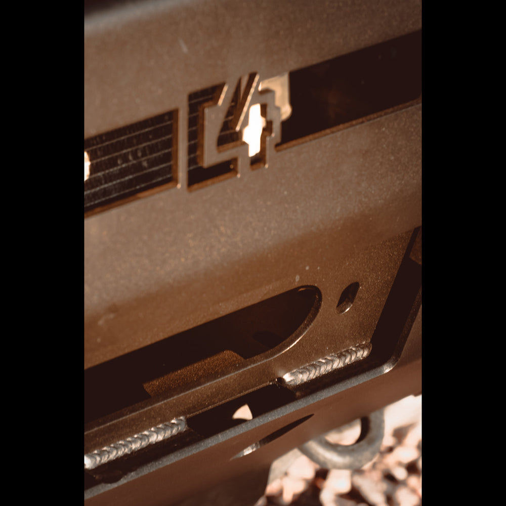 Close-up view of the C4 logo in the front of a Hybrid winch bumper.