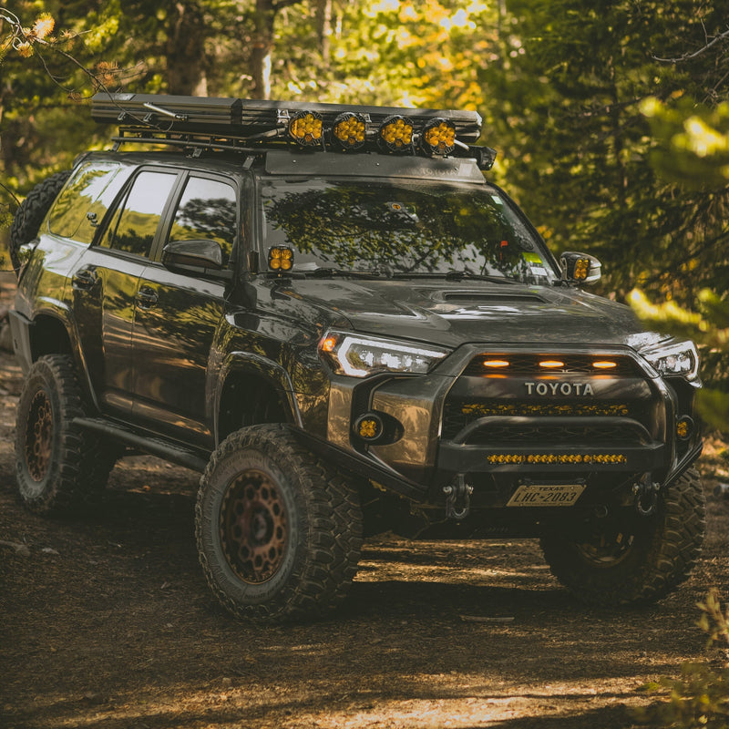 Quartering on view of a grey 4Runner with the C4 Lo-Pro bumper and its High Clearance Additions. 