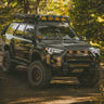 Quartering on view of a grey 4Runner with the C4 Lo-Pro bumper and its High Clearance Additions. 
