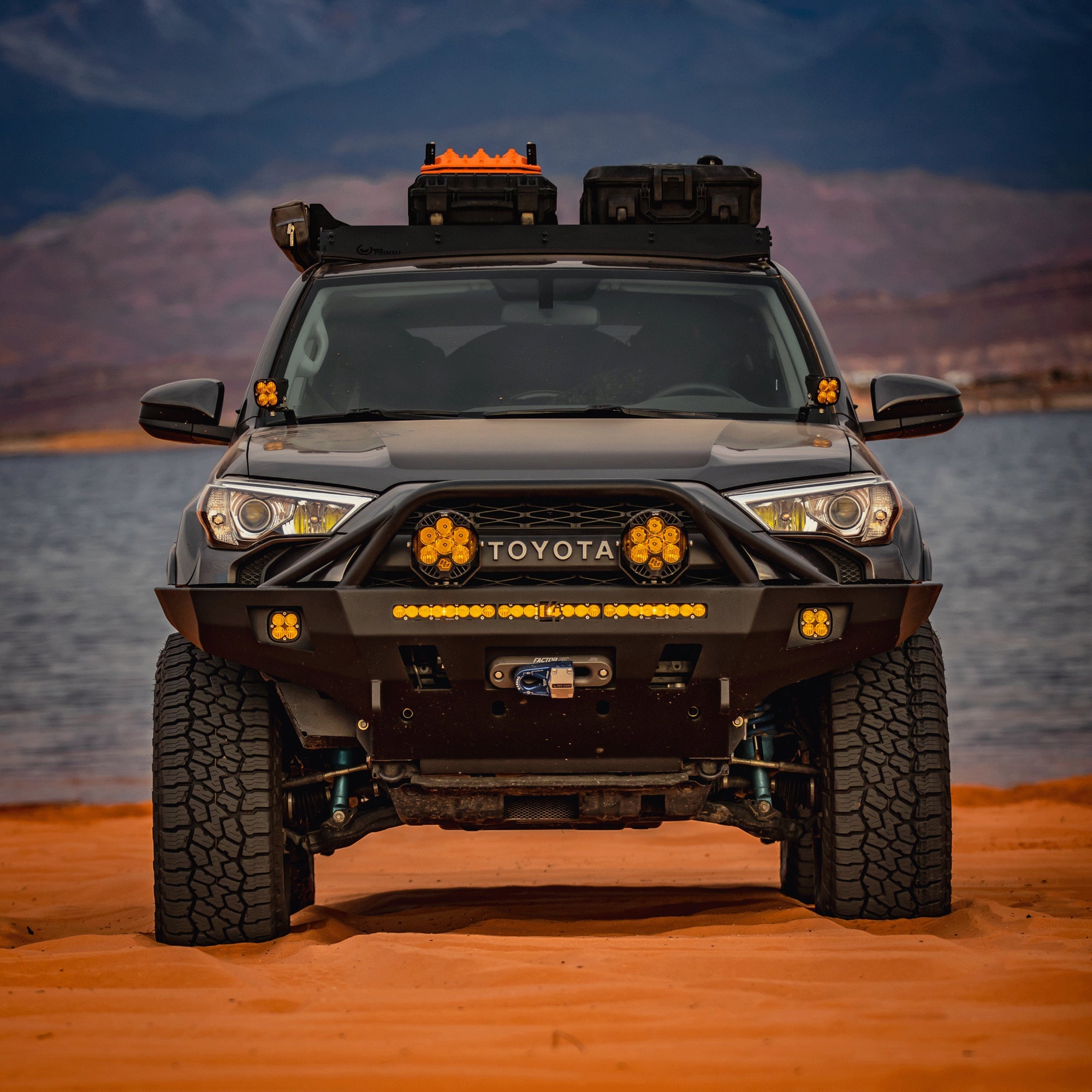 5th Gen 4Runner on a sandy beach equipped with the C4 winch bumper with full-height bull bar with tube gussets. 