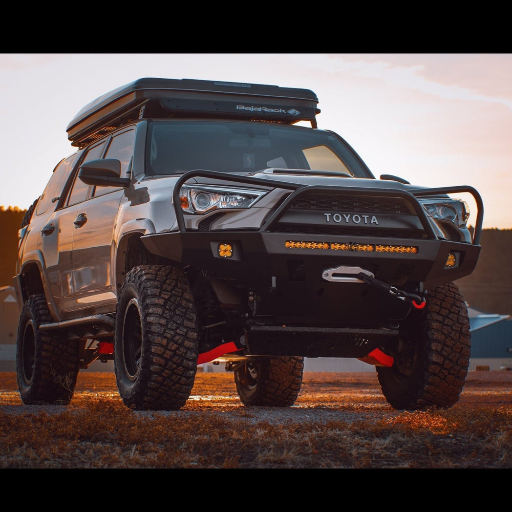 Grey 4Runner equipped with the C4 Overland winch bumper for the 5th Gen 4Runner with full-height bull bar and headlight hoops. 