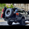 Low-angle quartering view of the C4 Fabrications rear bumper for 2010-2024 4Runners equipped with dual swing-outs for spare tire and accessories. 