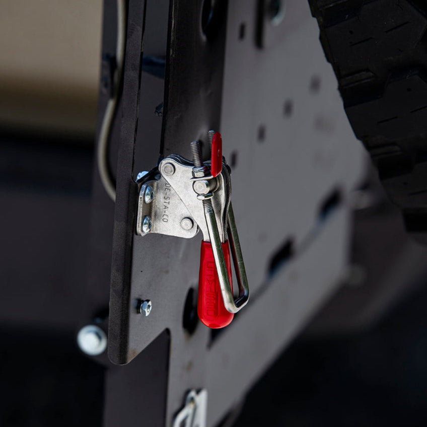 Close-up view of the adjustable-tension latch for the C4 dual swing rear bumper that helps tie the top of both swinging assemblies together. 