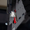 Close-up view of the adjustable-tension latch for the C4 dual swing rear bumper that helps tie the top of both swinging assemblies together. 