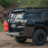Black 4Runner with oversized tires, roof rack and C4 Summit hatch ladder.