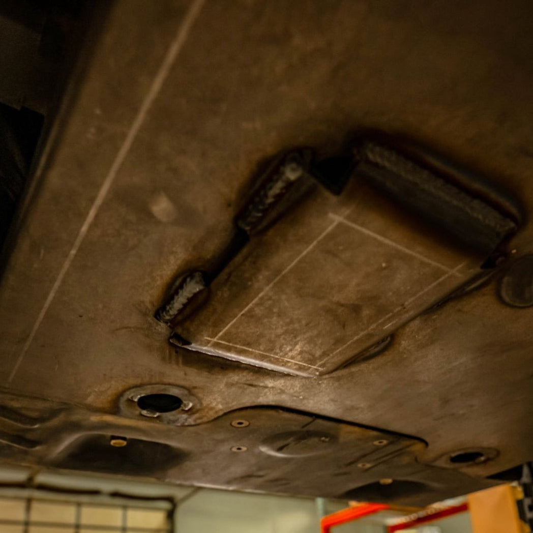 Close-up view of the structure on the outside of the C4 skid plate. 