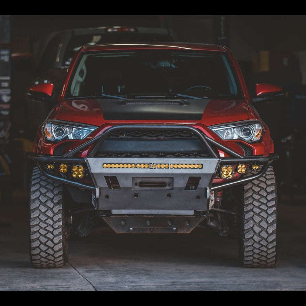 Shadowy photo of a 5th Gen 4Runner with a C4 Hybrid bumper with full-height bull bar and a full complement of aftermarket LED lighting.