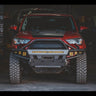 Shadowy photo of a 5th Gen 4Runner with a C4 Hybrid bumper with full-height bull bar and a full complement of aftermarket LED lighting.