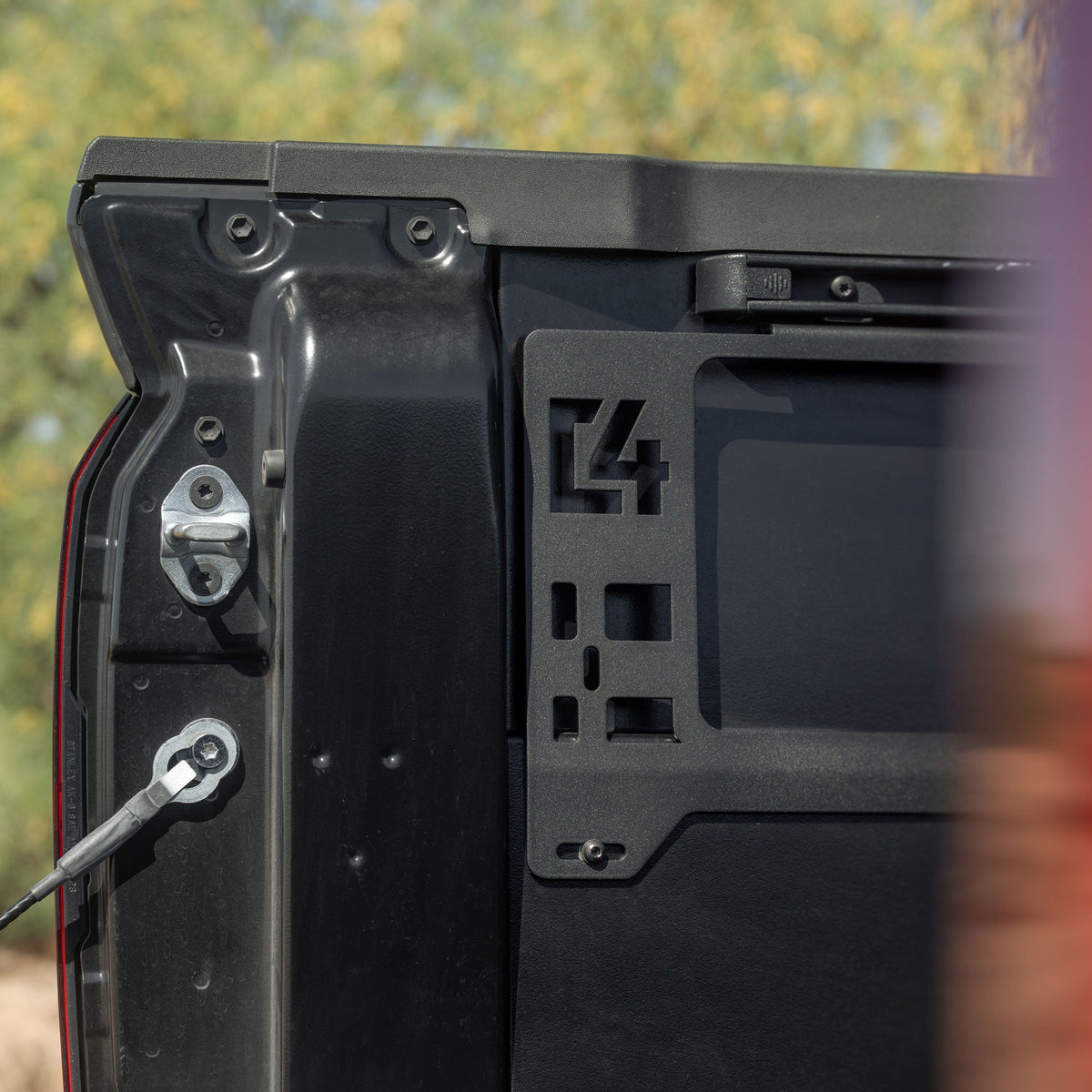 Detail image of C4 logo on Toyota Tacoma Bed Side MOLLE Panels