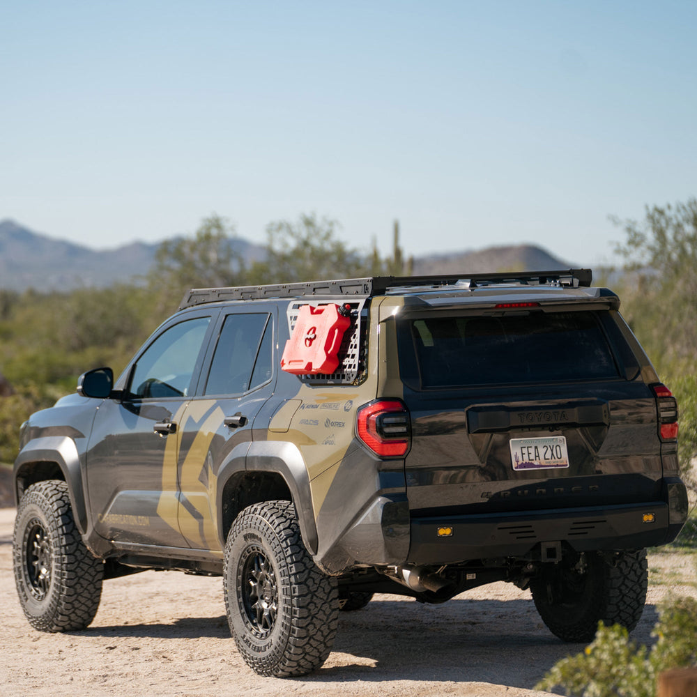 Off-road 4Runner with a C4 roof rack in a desert landscape with the Exterior MOLLE panel add-ons.