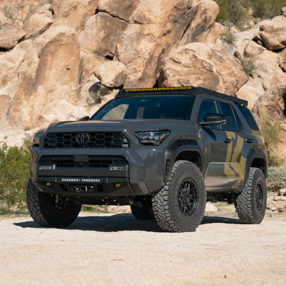 6th Gen 4Runner with C4 Lo Pro Front Bumper, Desert setting with rocky background.