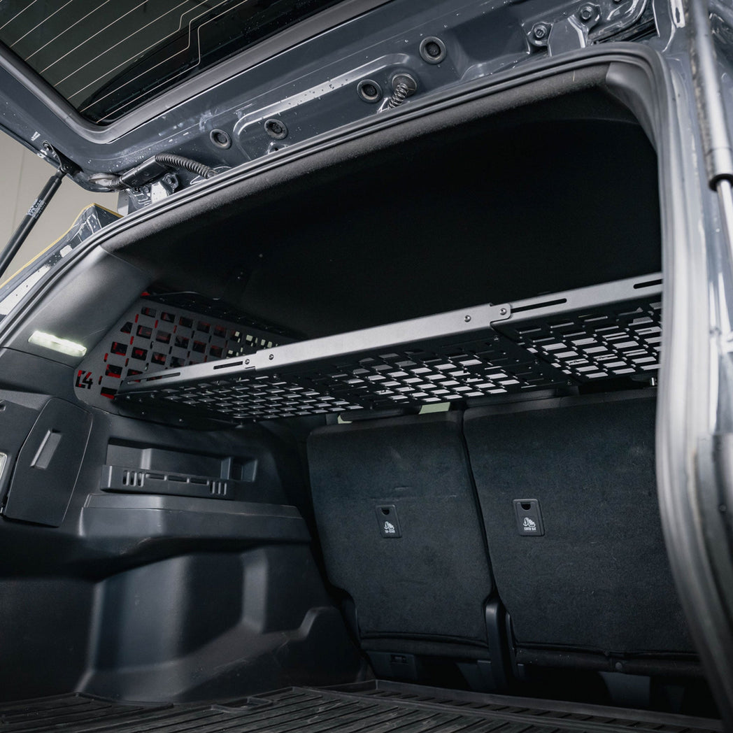 6th Gen 4Runner MOLLE Panel Shelf for Rear Window Molle Panels at headrest level.