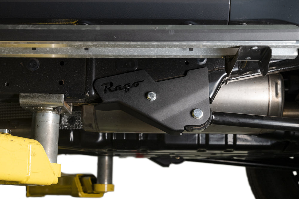 A 6th Gen Toyota 4Runner Trailing Arm Skid Plate installed to the factory trailing arm.