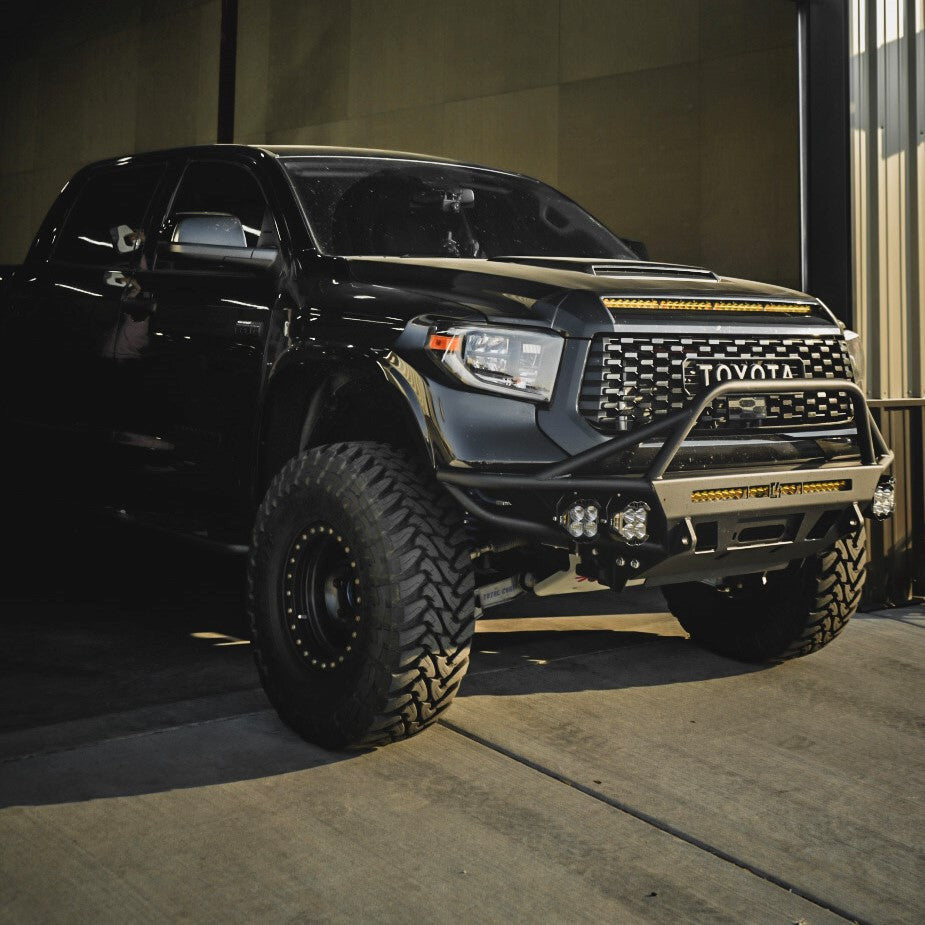 Quartering on photo of the C4 Hybrid bumper for the 2014+ Tundra installed on a black Crew Max. 