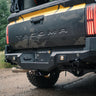 Close-up showing the bolt-together design of the C4 Overland rear bumper for the 2024+ Tacoma.