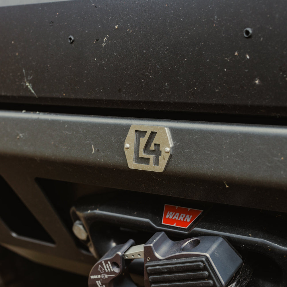 Close up of the front surface of the C4 Lo-Pro winch bumper and the C4 logo plate.