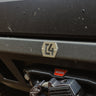 Close up of the front surface of the C4 Lo-Pro winch bumper and the C4 logo plate.