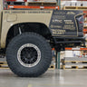 Low-angle side view showing the extreme departure angle provided by the C4 Rock Runner rear bumper for the 3rd Gen Tacoma.