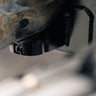 View of the C4 Body Mount Relocation kit and its weld-on frame reinforcement plate. 