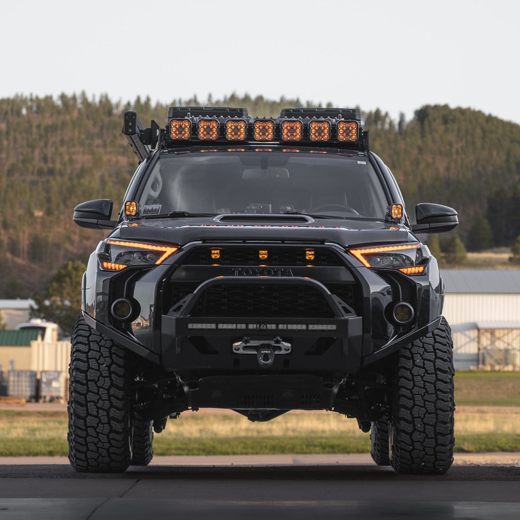 A blacked-out 4Runner with the C4 Lo-Pro winch bumper for 2014+ Toyota 4Runners.