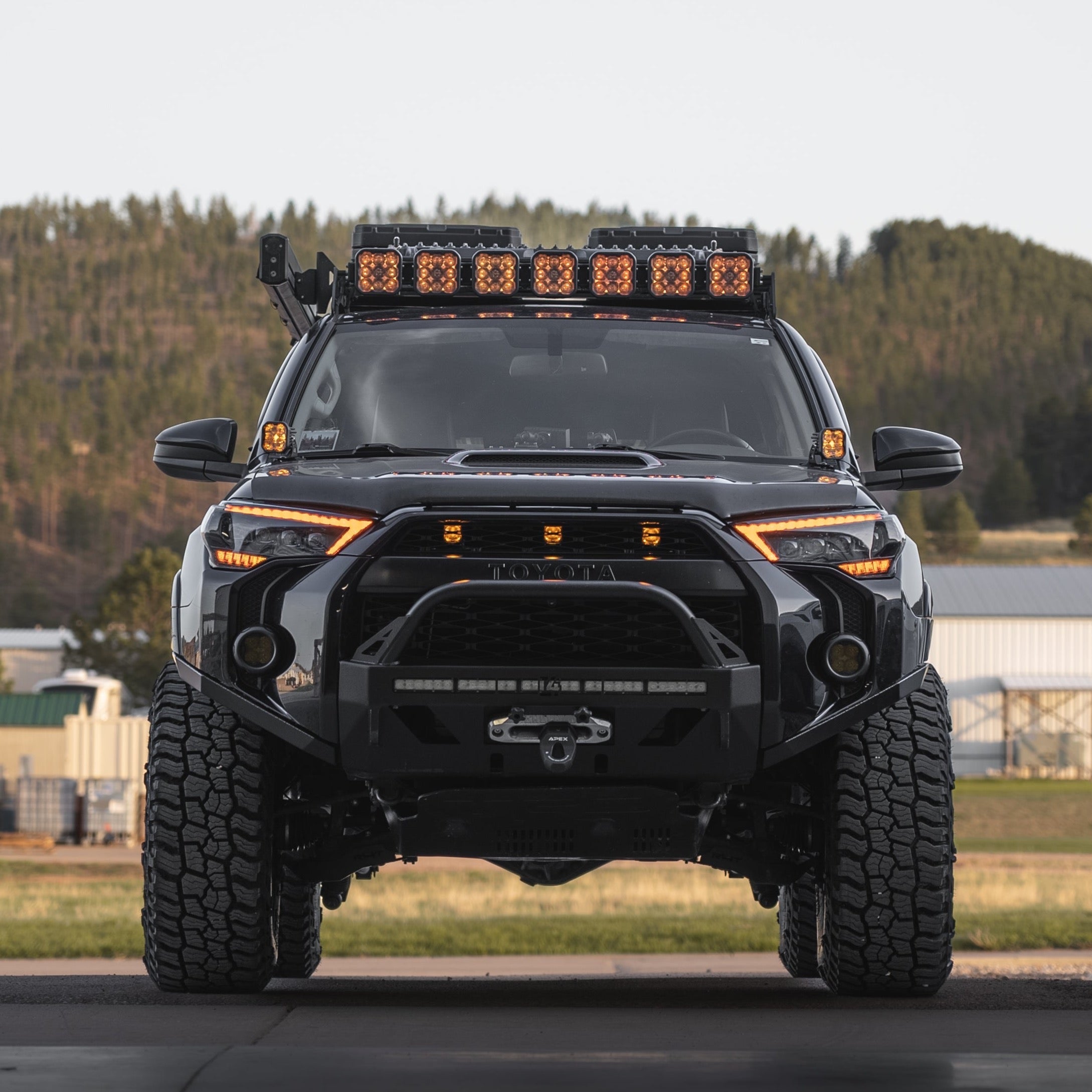 A blacked-out 4Runner with the C4 Lo-Pro winch bumper for 2014+ Toyota 4Runners.