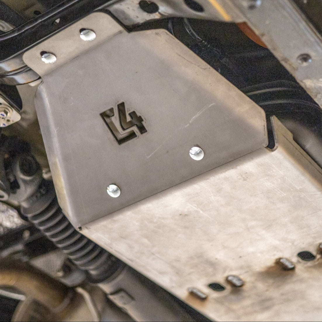 Cover photo of the 2nd Gen Tacoma fuel tank skid from C4 with the skid emphasized and everything else faded out.
