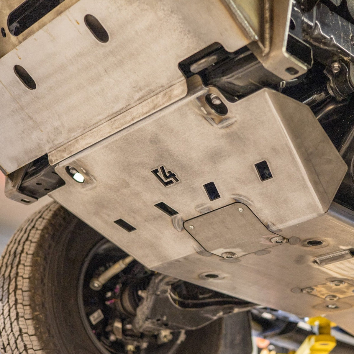 Cover photo for the C4 Front Skid Plate for the 2nd Gen Tacoma with the background faded out and the skid emphasized. 
