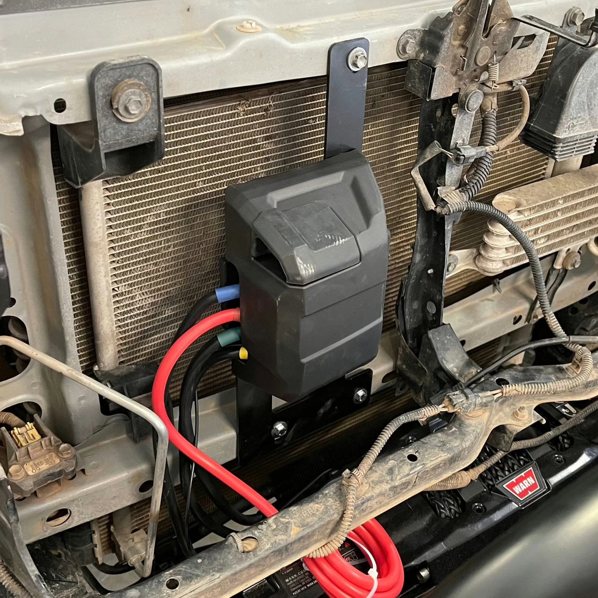 Cover photo for the winch relocation bracket with the bracket emphasized and the background faded out.