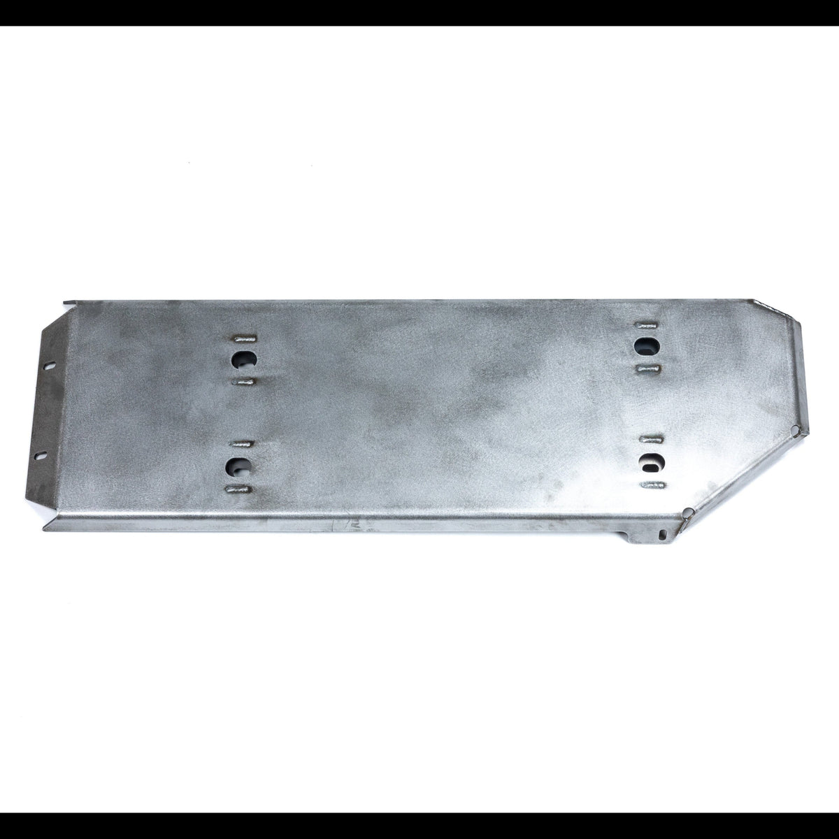 View of the fuel tank skid sitting on a white table.