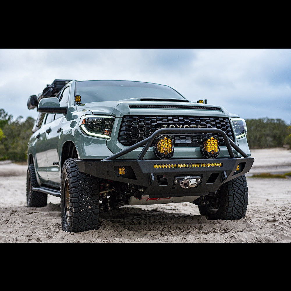 Late 2nd Generation Tundra parked on the beach with an Overland winch bumper installed.